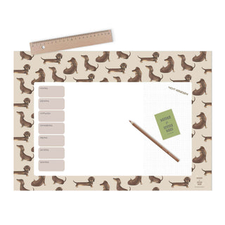 Wochenplaner mit Dackelmotiv, To-Do-Listen, skandinavischem Design, Bleistift und Holzlineal auf der Oberseite.